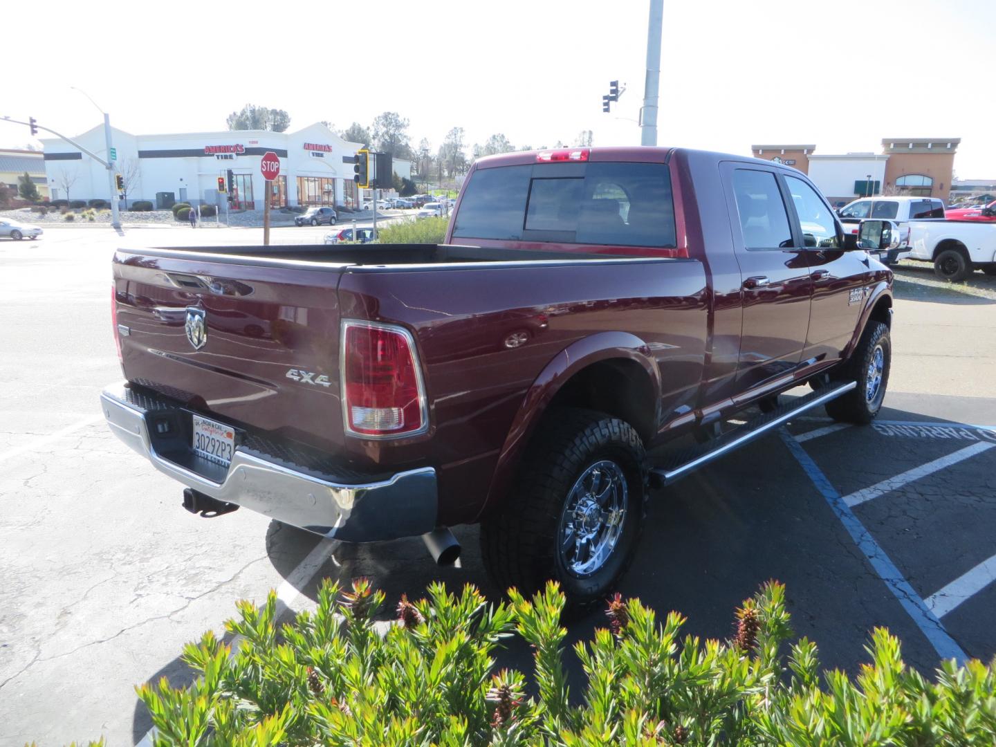 2017 MAROON /TAN RAM 3500 Laramie Mega Cab 4WD (3C63R3ML6HG) with an 6.7L V8 OHV 16V DIESEL engine, automatic transmission, located at 2630 Grass Valley Highway, Auburn, CA, 95603, (530) 508-5100, 38.937893, -121.095482 - Photo#4